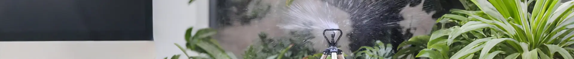 A butterfly sprinkler is spraying water.