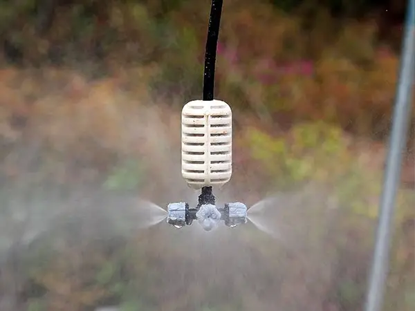 A gray four-head atomizing sprinkler in irrigation