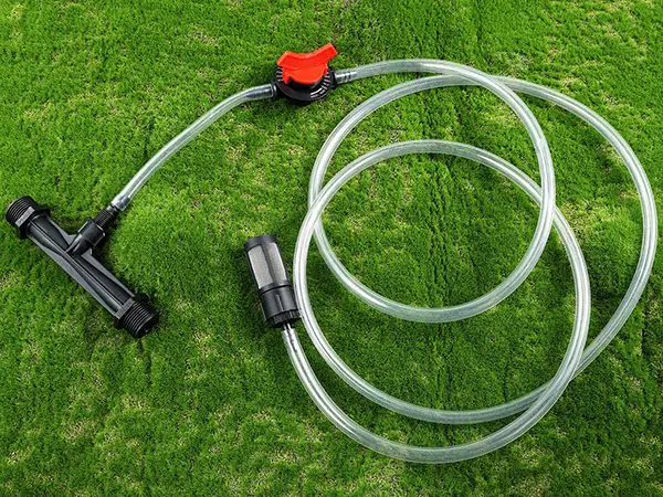 A venturi fertilizer injector is placed on the ground.